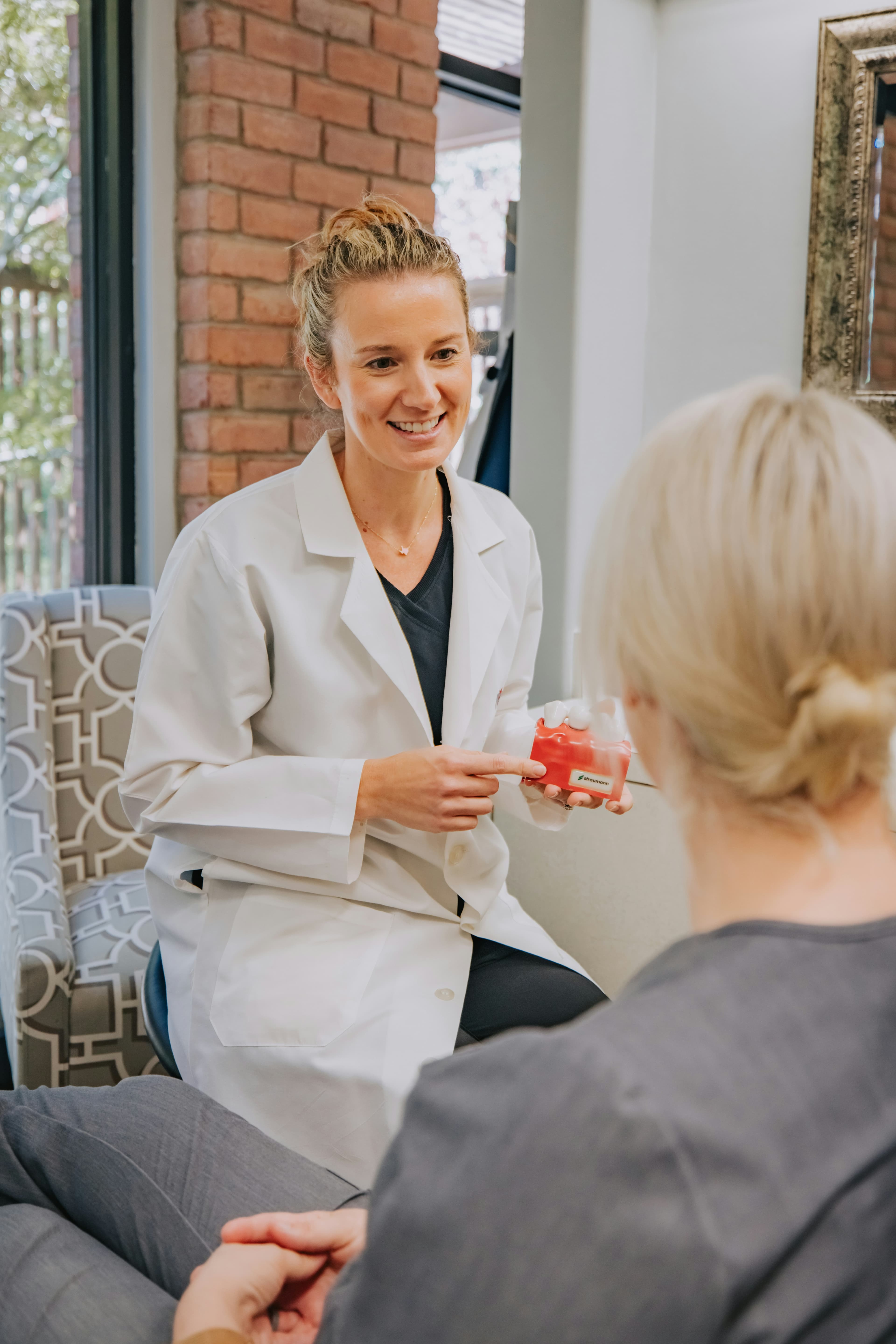 Doctor speaking with a patient during a consultation.